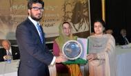 Dr Aalia Sohail Khan, Principal, Govt. Post Graduate College for Women, Rawalpindi presenting the College Shield to Sahibzada Sultan Ahmad Ali, Chairman MUSLIM Institute