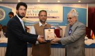 Sahibzada Sultan Ahmad Ali Chairman MUSLIM institute and Sardar Ateeq Ahamd Khan ( Former Prime Minister, Azad Jamu & Kashmir) Presenting Shield to Dr. Gholum Reza Aavani