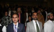 Participants Standing During National Anthem in Mehfil Kalam-e-Iqbal
